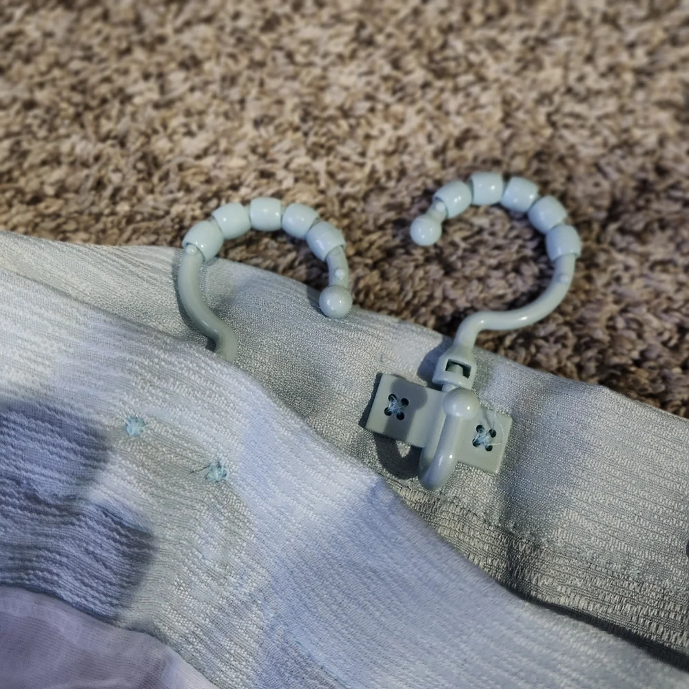 Light Green Shower Curtain With Rod Hooks Attached..